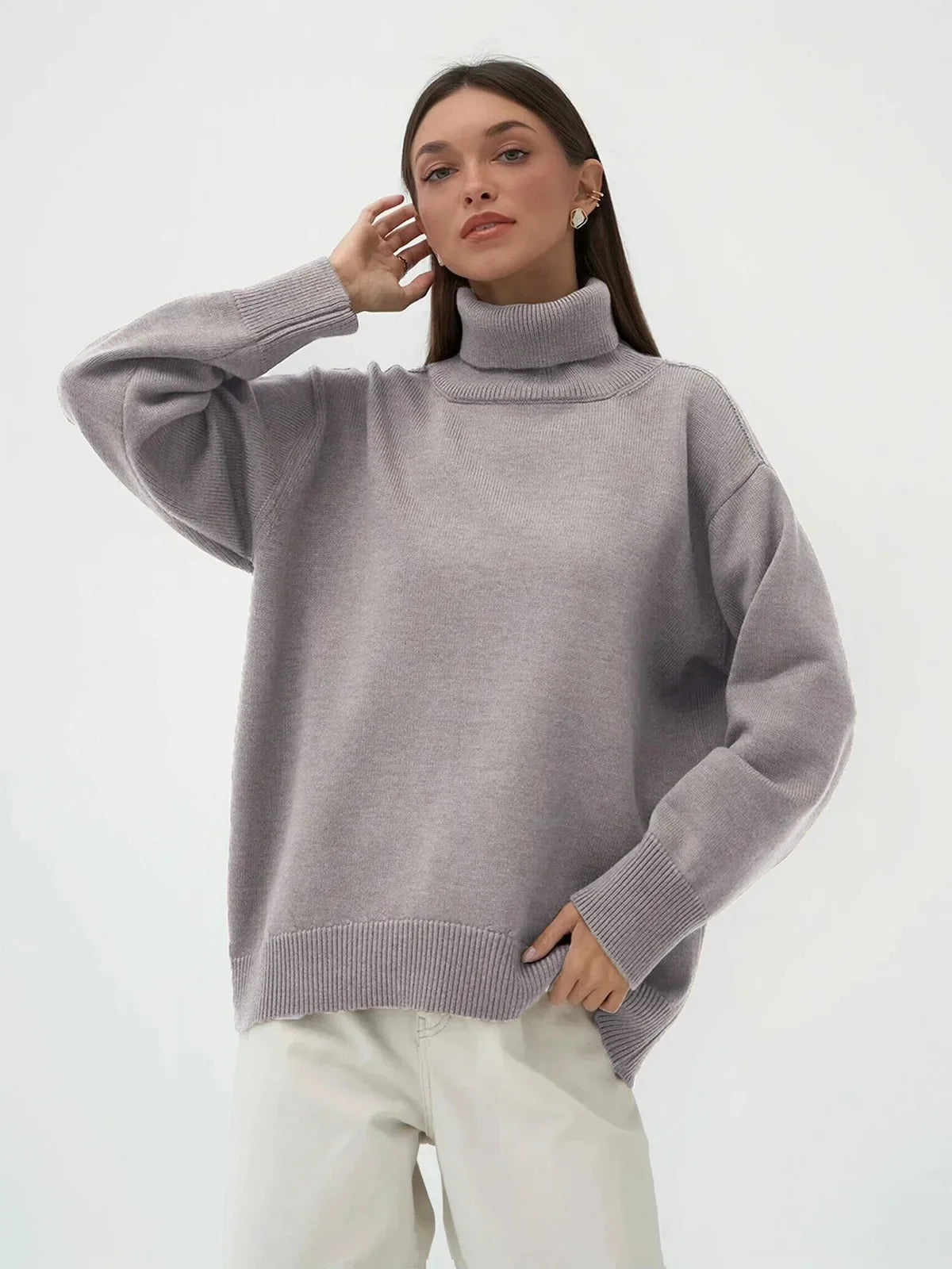 Women's oversized cream ribbed turtleneck sweater with soft knit blend and relaxed silhouette