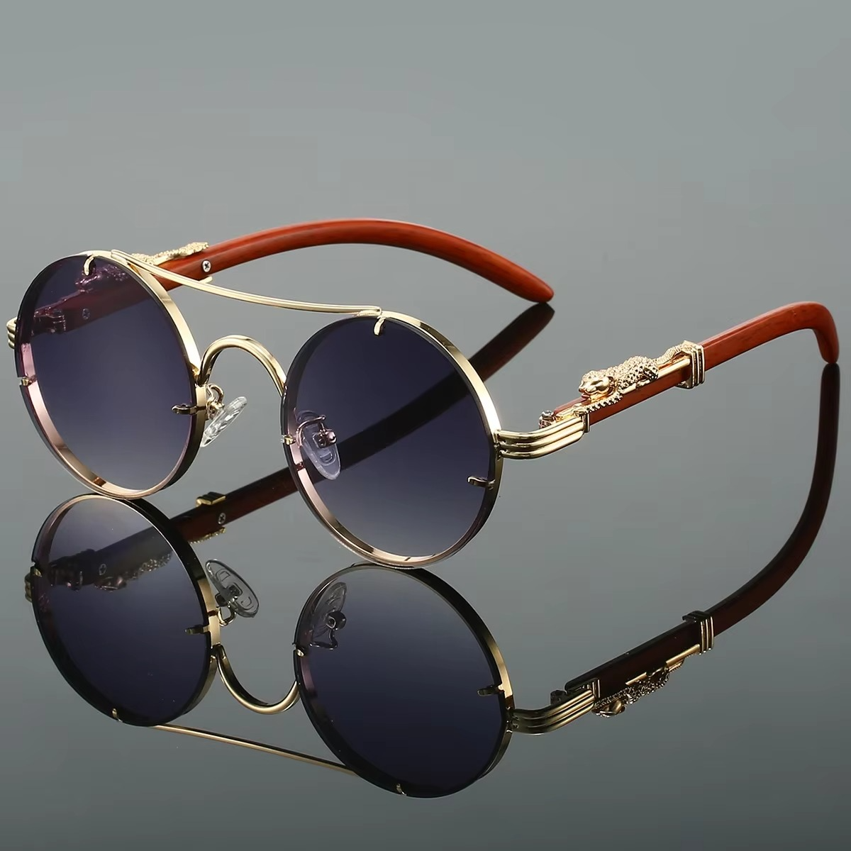Vintage round unisex sunglasses gold-tone double bridge frame with bold red tinted lenses featherweight