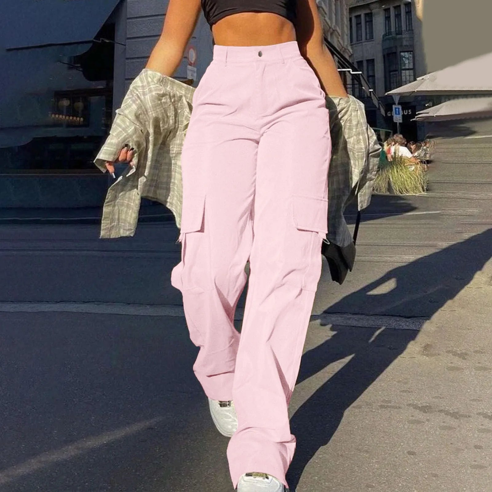 Women's high waist wide leg cargo trousers in neutral tone with functional side cargo pockets