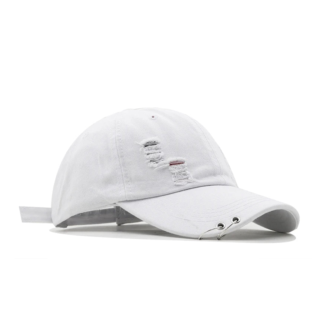 Distressed denim streetwear hat with pierced curved brim, metal hardware, and adjustable strap