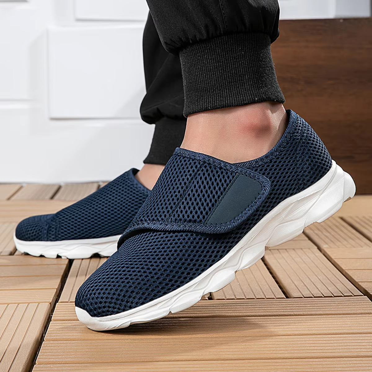 Gray orthopedic wide-fit walking shoes with adjustable strap closure and breathable diabetic-friendly design