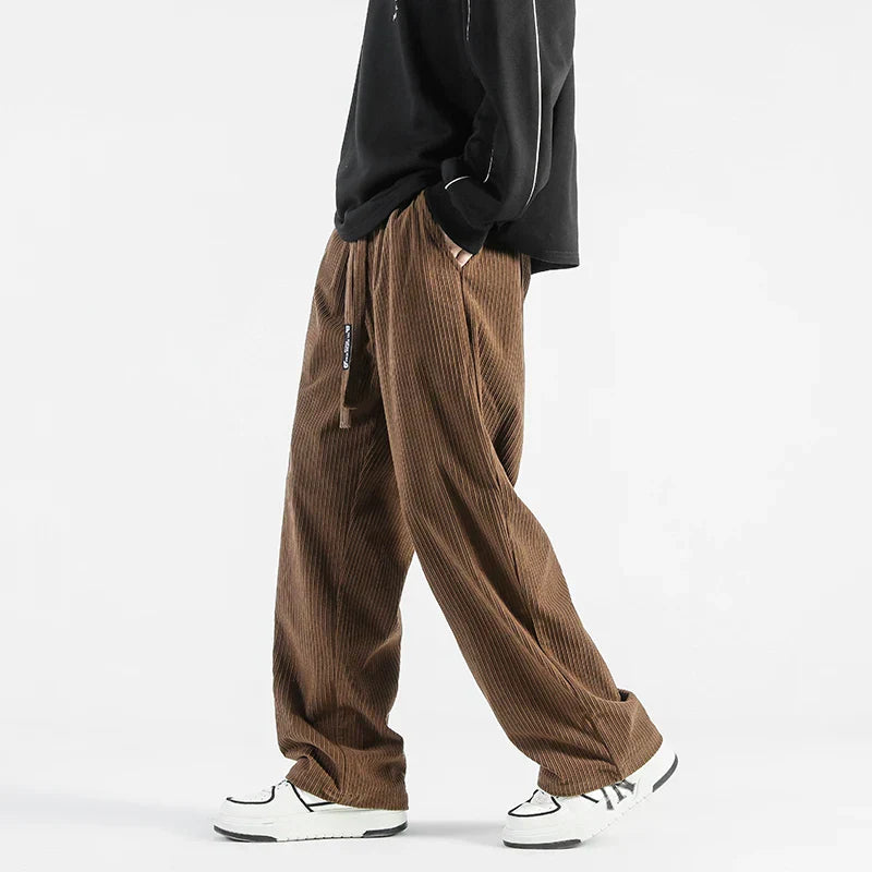 Men's relaxed straight fit corduroy pants with elastic waistband, soft ribbed texture, casual style