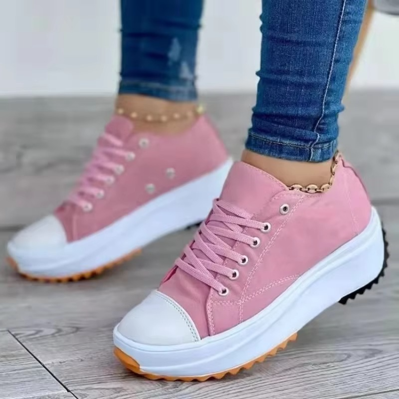 Women's white canvas platform sneakers with breathable upper and lightweight comfort sole, casual style