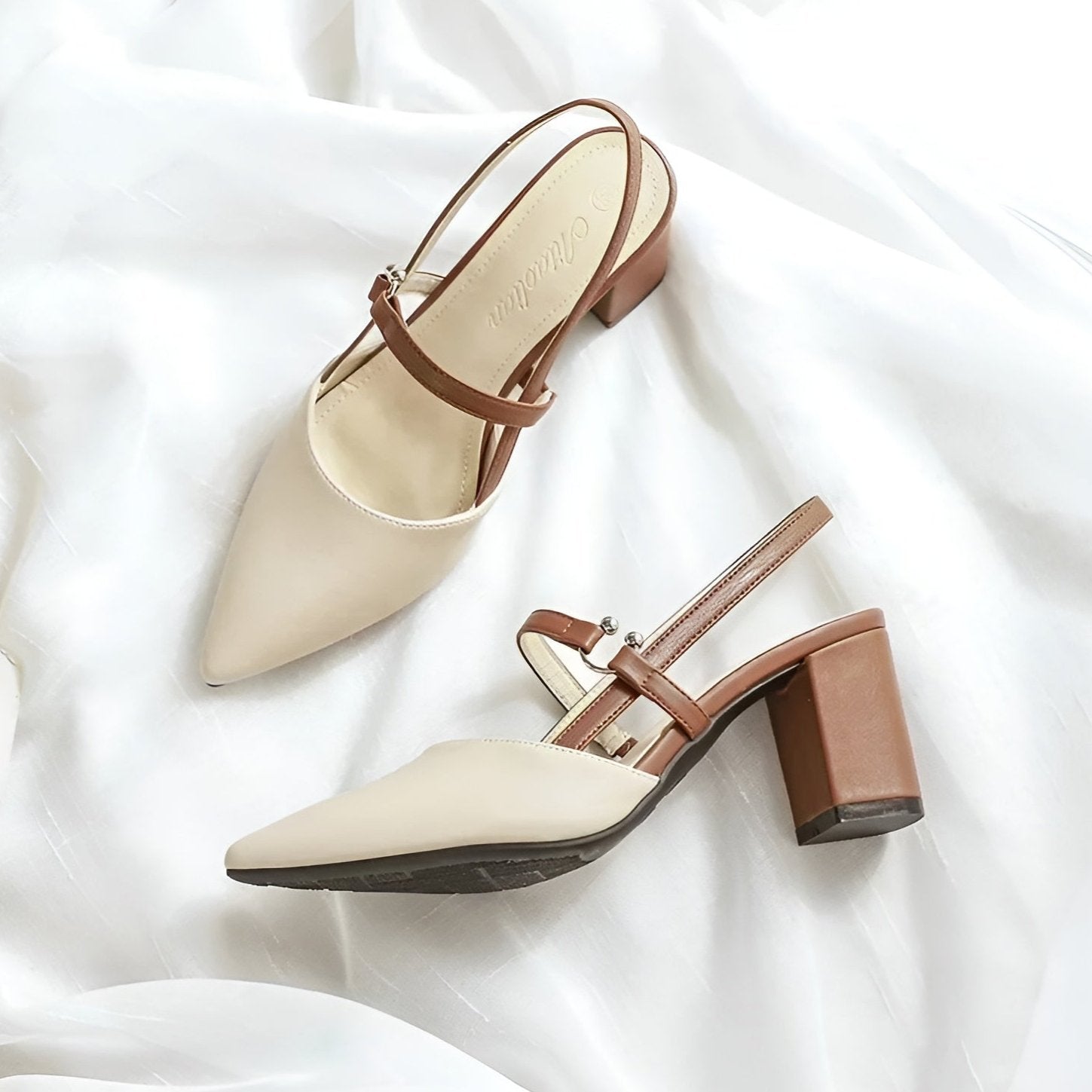 Women's color-block slingback heels with pointed toe, bold contrast panels, day-to-night style
