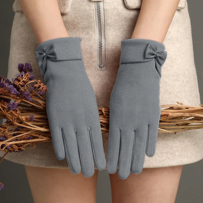 Women fitted wool wrist-length gloves in classic color with bow detail accent for sophisticated style