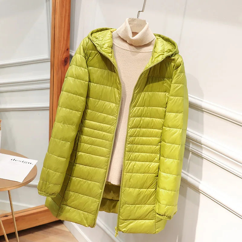 Women's long puffer jacket with hood, regular fit, elongated silhouette for warmth and style