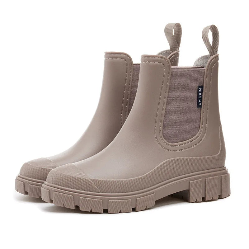 Women's black Chelsea rain boots waterproof ankle-high slip-on style with elastic side panels