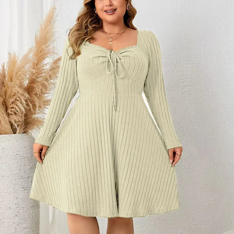 Plus size black ribbed knit dress with lace-up neckline, all-way stretch, slimming silhouette
