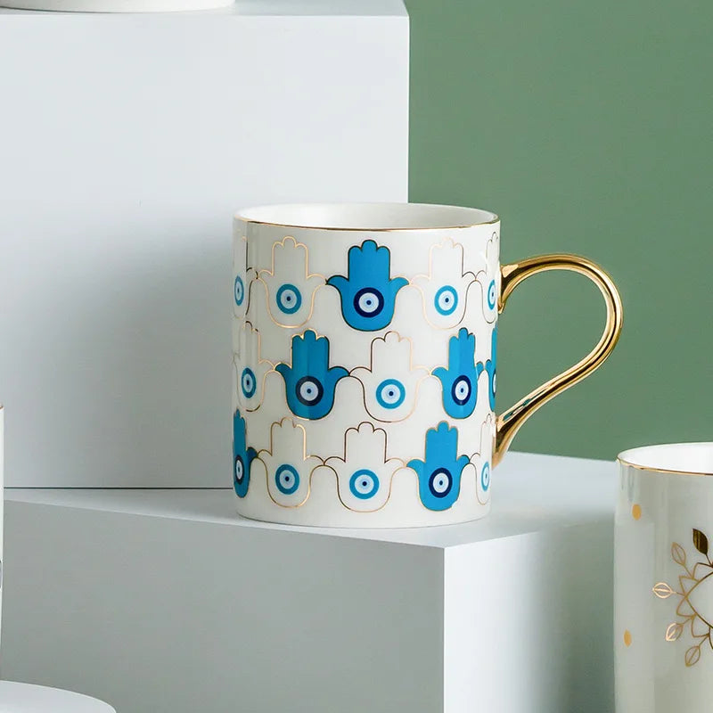 Evil Eye ceramic coffee mug gold trim Turkish craft positivity protection mystical design