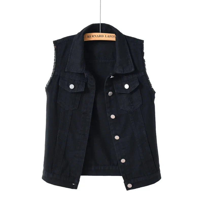 Oversized blue denim vest with distressed edges, multi-pocket design, and heavyweight streetwear silhouette