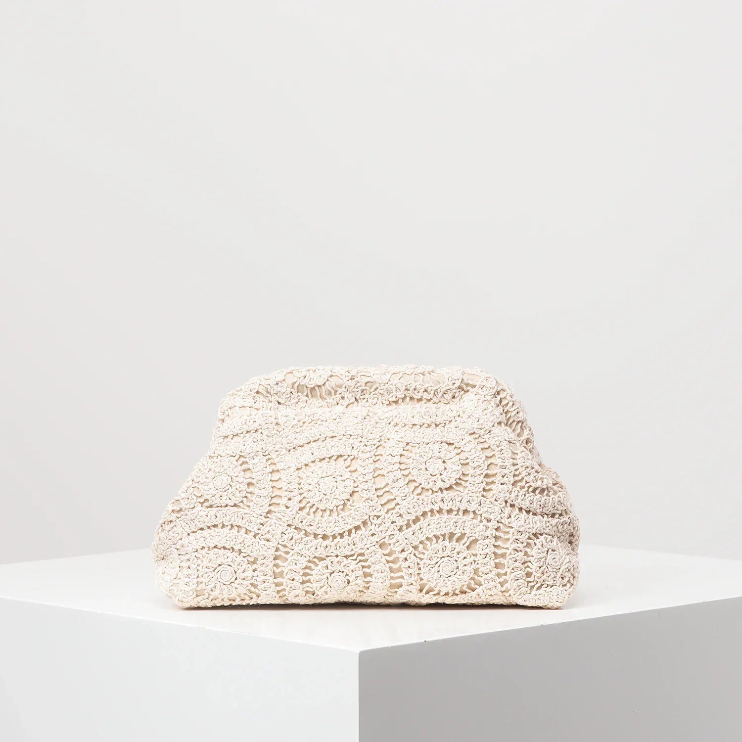 Bohemian handwoven straw clutch bag with intricate crochet lace overlay, lightweight compact women's purse