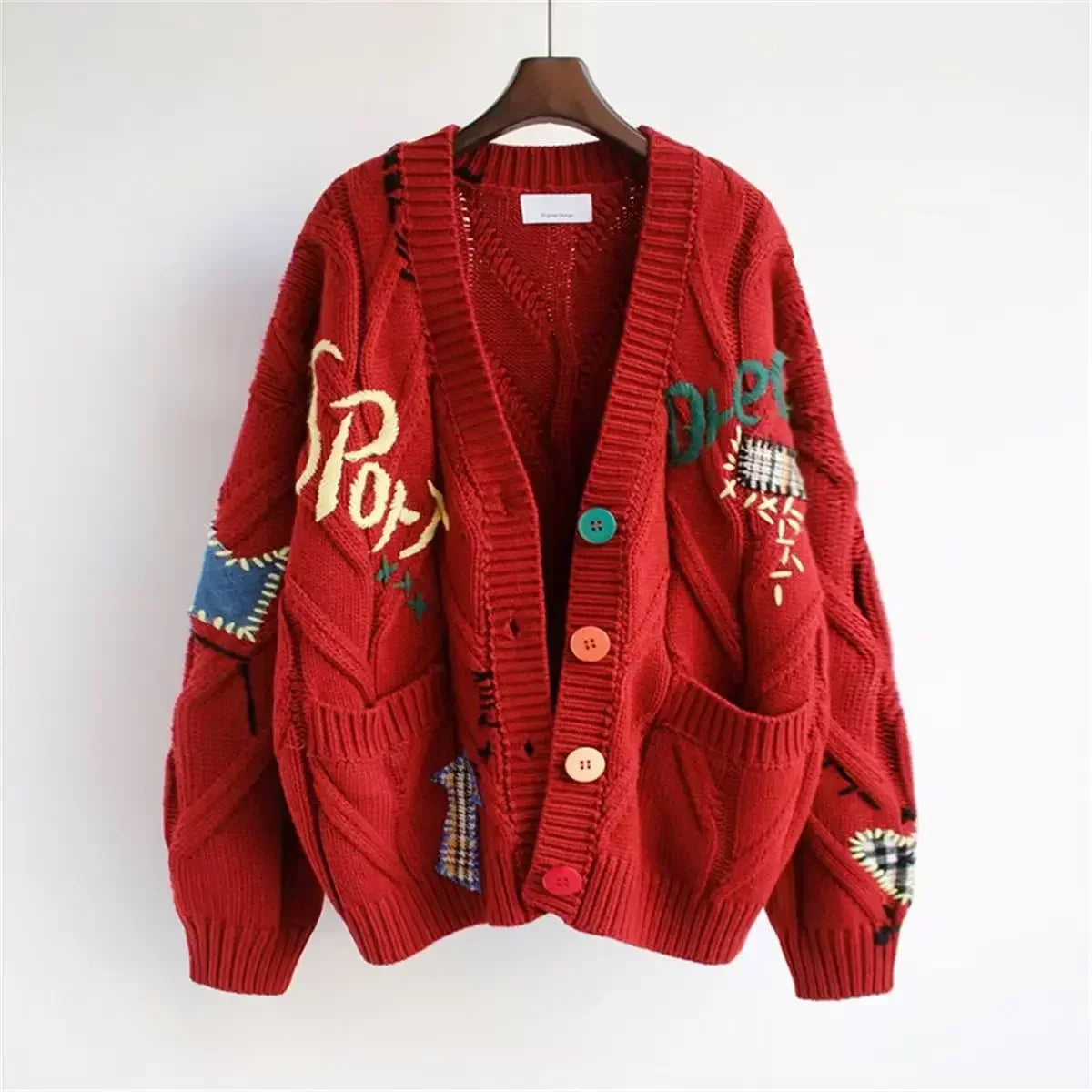 Relaxed-fit graphic knit cardigan with colorful buttons and hand-drawn embroidered details for creative style