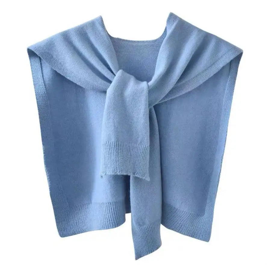 Women's knitted scarf wrap in cozy sweater-inspired texture with ribbed hem for versatile layering