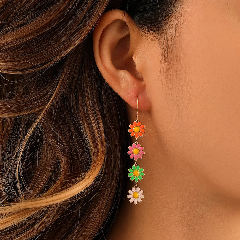 Lightweight dangling daisy chain earrings for women with soft swing movement and playful floral charm