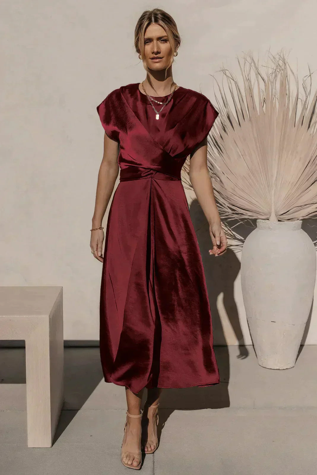Women's satin-look midi dress with V-neck wrap, A-line silhouette, and elegant lustrous finish
