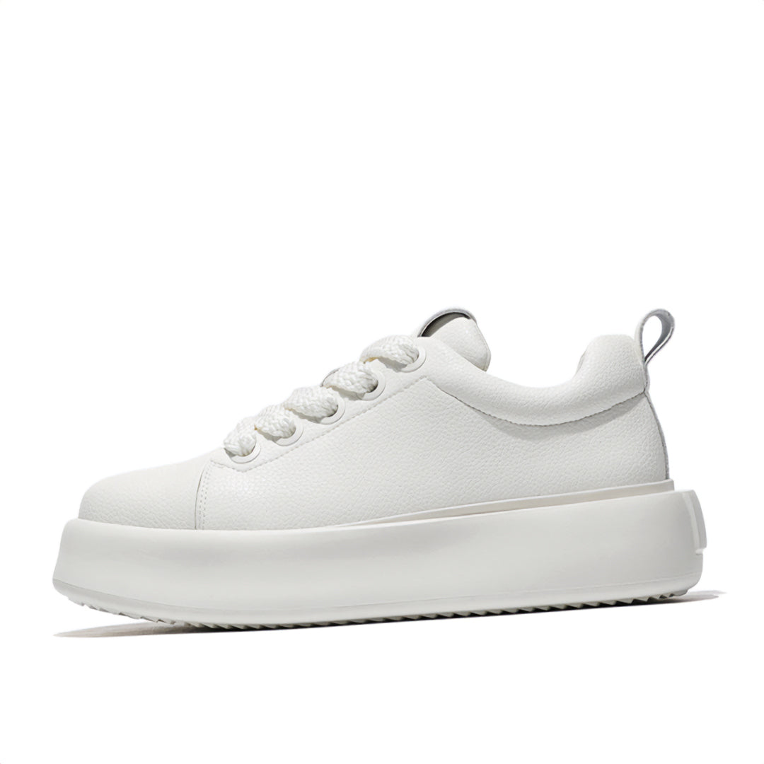Black and white genuine leather low top sneakers with minimalist design for modern gentleman