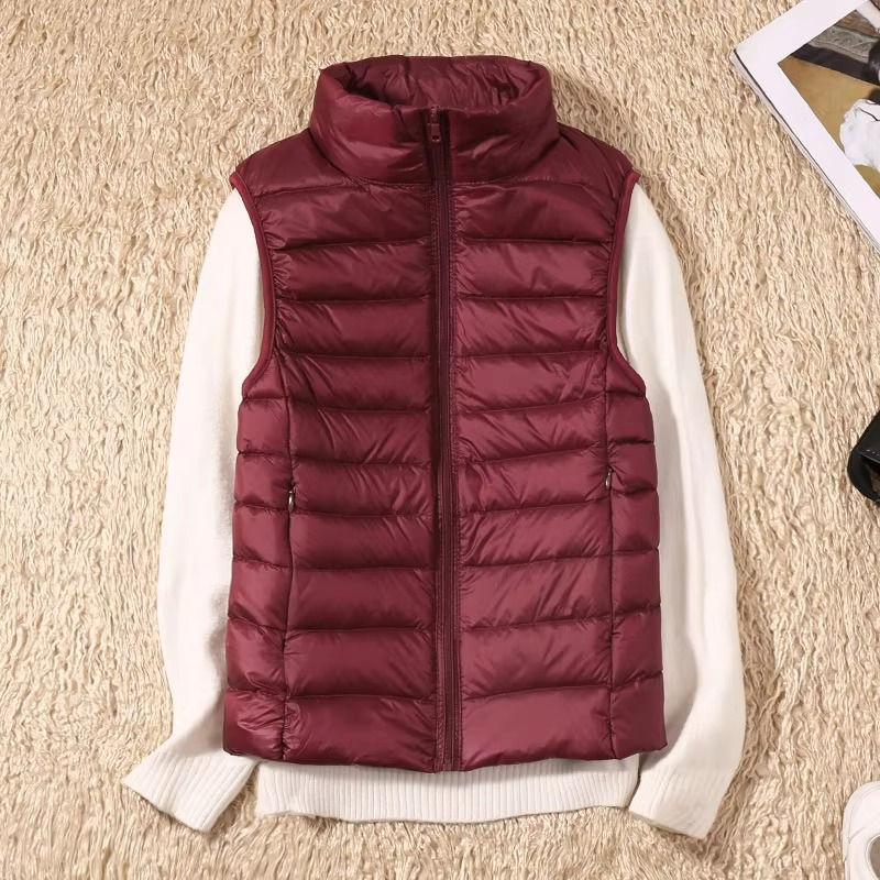 Women's cropped sleeveless down puffer vest lightweight nylon shell for layering outdoor adventures