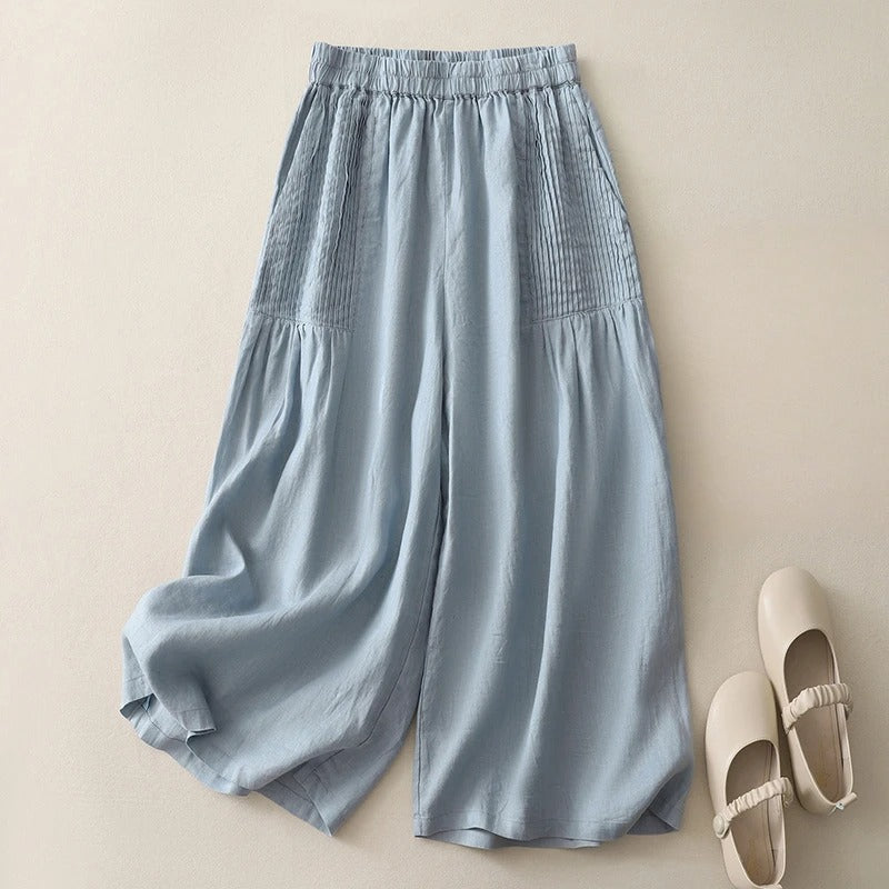 Women's beige linen wide-leg cropped pants with pintuck pleats and relaxed effortless silhouette