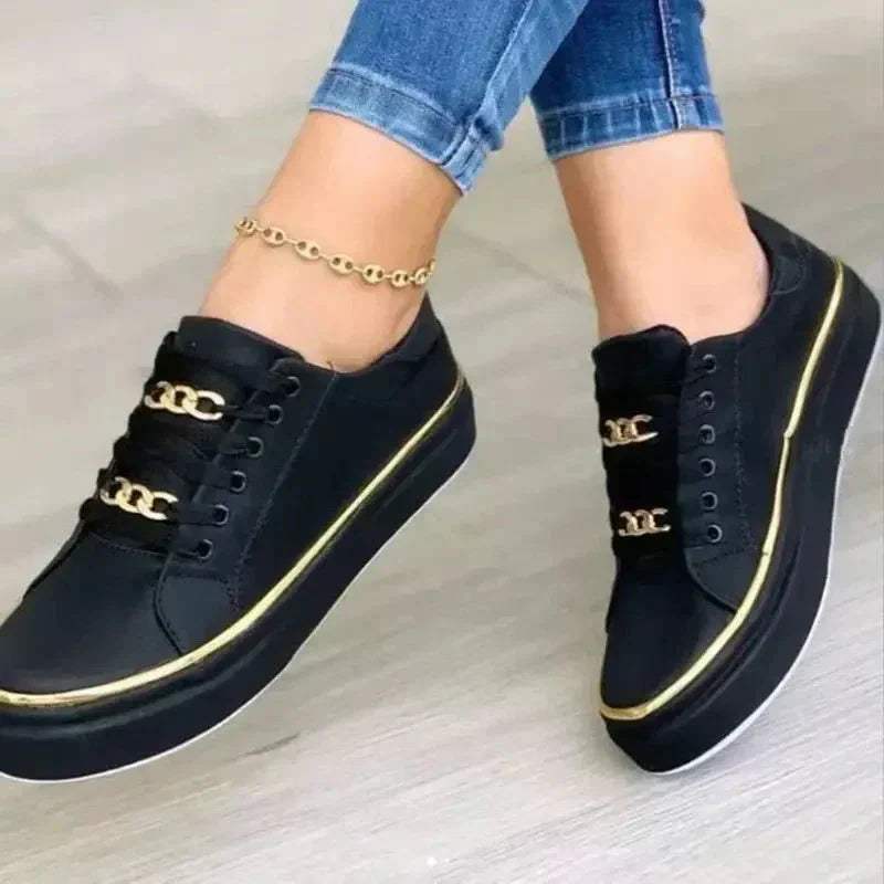 Women's white minimalist casual sneakers with metallic chain lace detail and cushioned sole