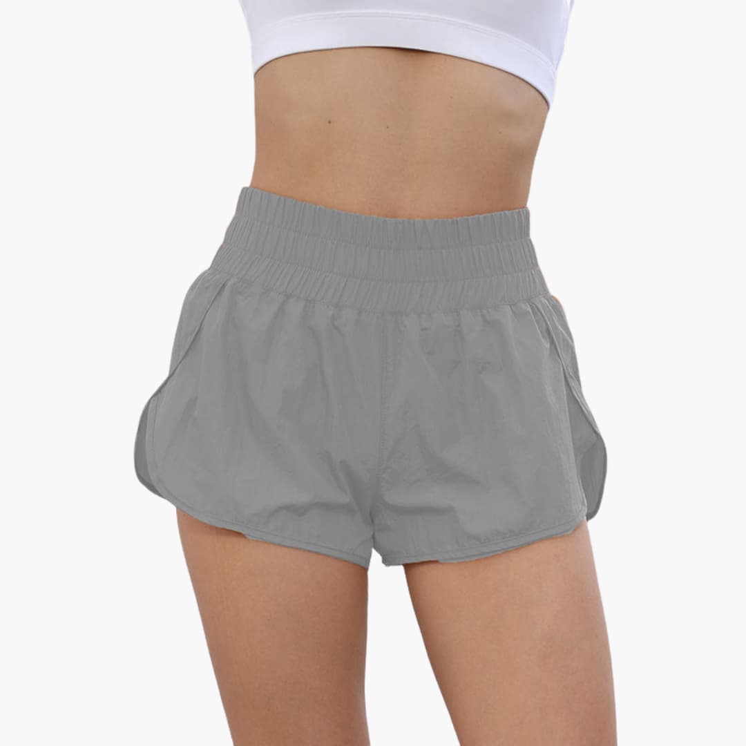 Women's running shorts with elastic waistband, side hip pockets, breathable pull-on design for training