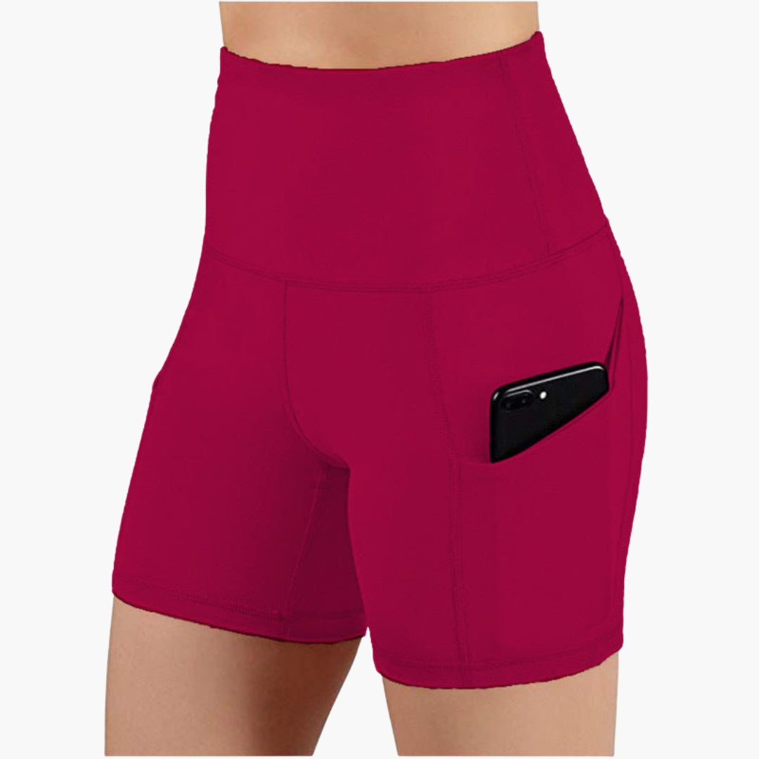 High-waisted women's sports shorts with side pockets, breathable pull-on fit for active comfort