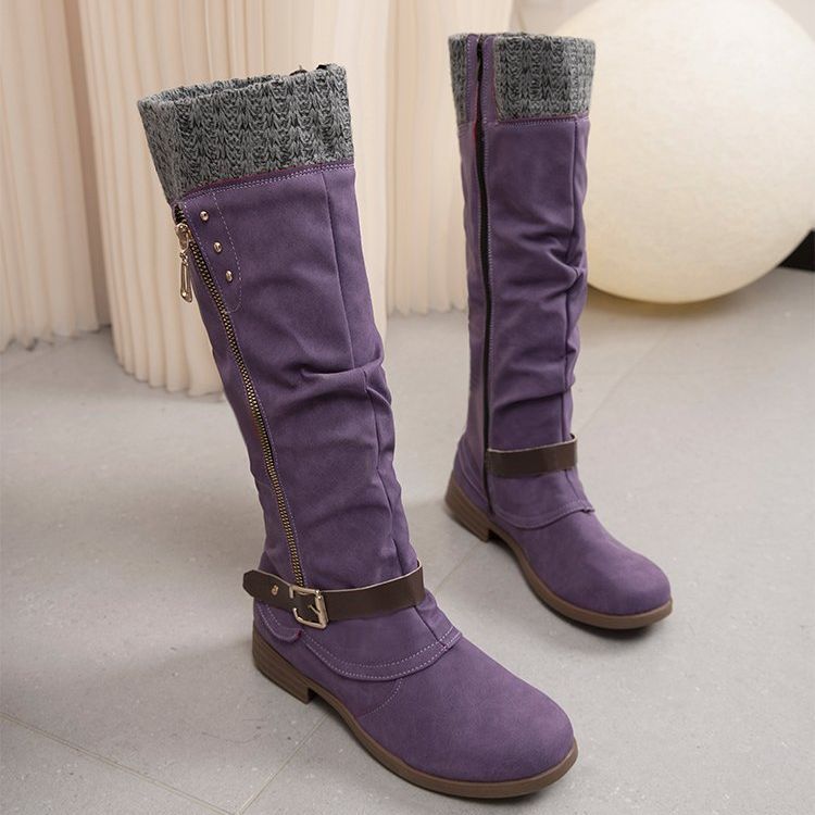 Women's black low heel boots with sleek silhouette and side zip closure for effortless autumn wear
