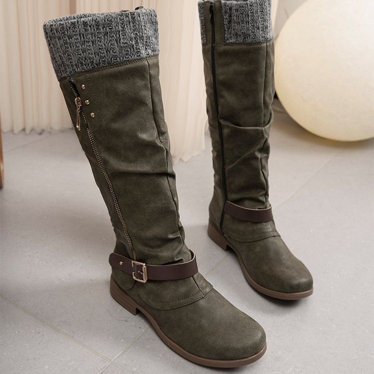 Women's black low heel boots with sleek side zip closure for effortless autumn winter style