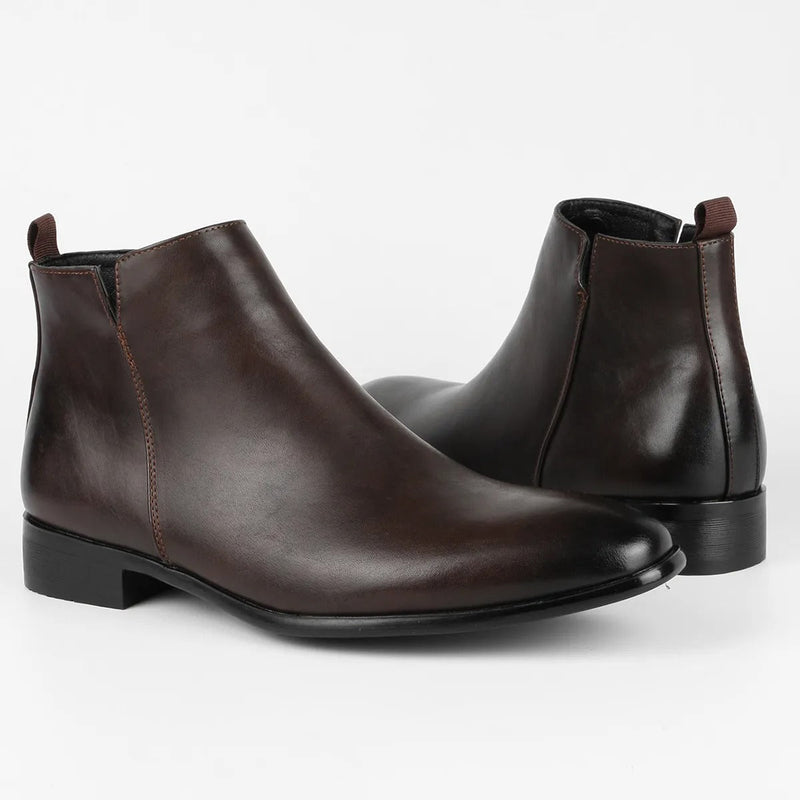 Men's sleek black ankle boots with side-zip closure, tapered silhouette, and low heel for modern everyday wear
