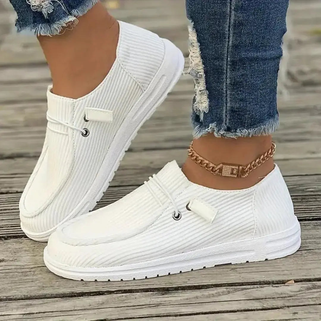 Women's beige ribbed slip-on casual sneakers with breathable textile upper and flexible lightweight sole