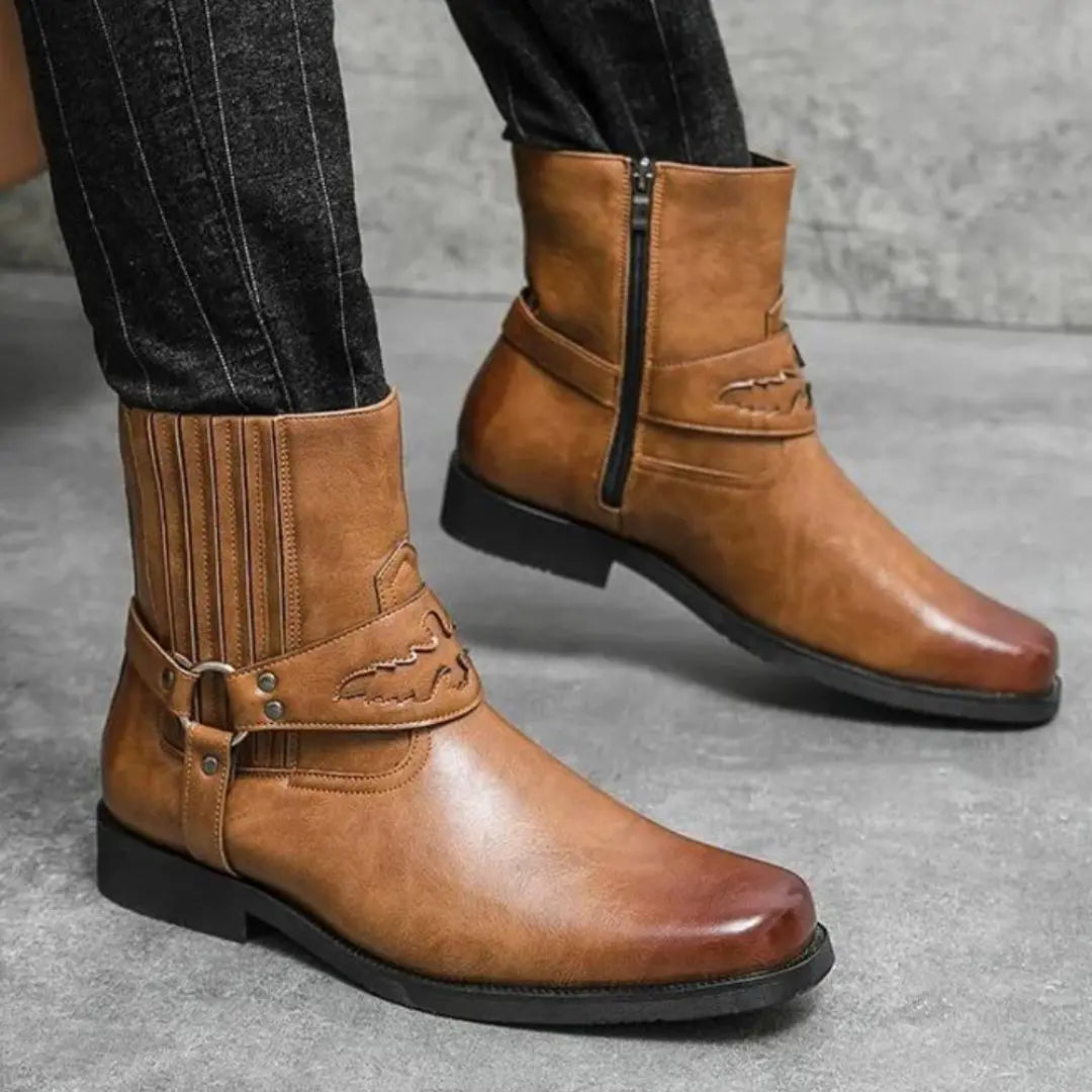 Brown faux leather Western boots with bold strap detail, vintage-inspired modern streetwear silhouette