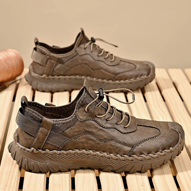 Silva genuine leather trail sneakers with adaptive lacing, cushioned sole, and artisan stitching for active wear