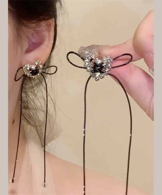 Boucles d'oreilles pendantes simples en cuivre noir avec nœud d'amour et pompon - Urbann-Vibe