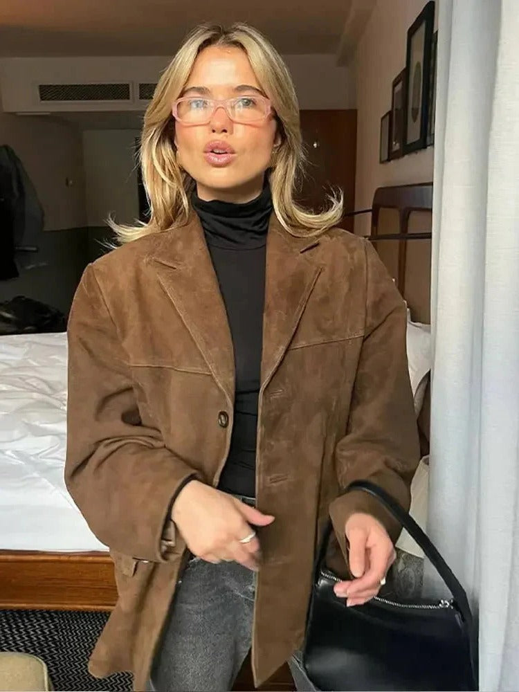 Neutral women's minimalist structured jacket with clean silhouette for effortless everyday layering