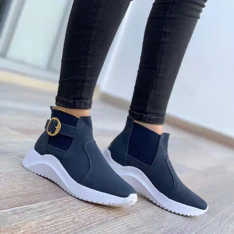 Women's black faux leather platform ankle boots slip-on style with decorative buckle strap