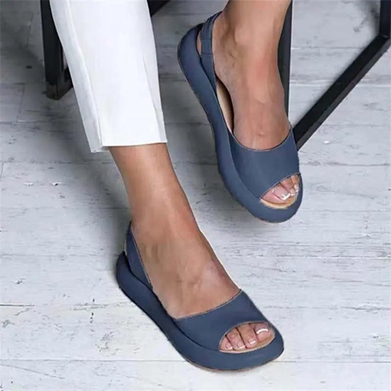 Women's beige peep-toe slingback flats with secure ankle strap for all-day breathable comfort