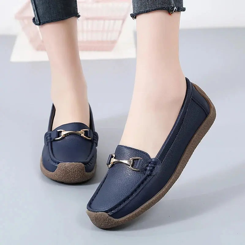 Women's slip-on moccasin flats in neutral tone, soft faux leather upper with flexible sole for all-day comfort