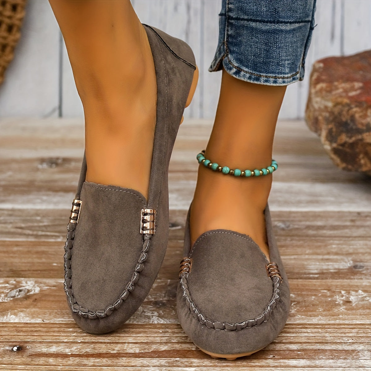 Women's slip-on moccasin loafers in neutral tone, casual style with lightweight rubber sole