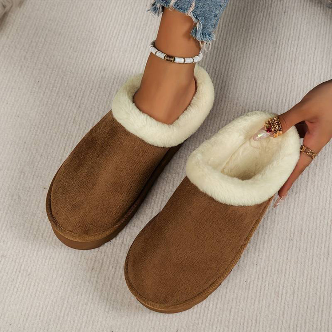 Women's slip-on winter boots with plush lining, low-profile silhouette, cozy cold-weather style