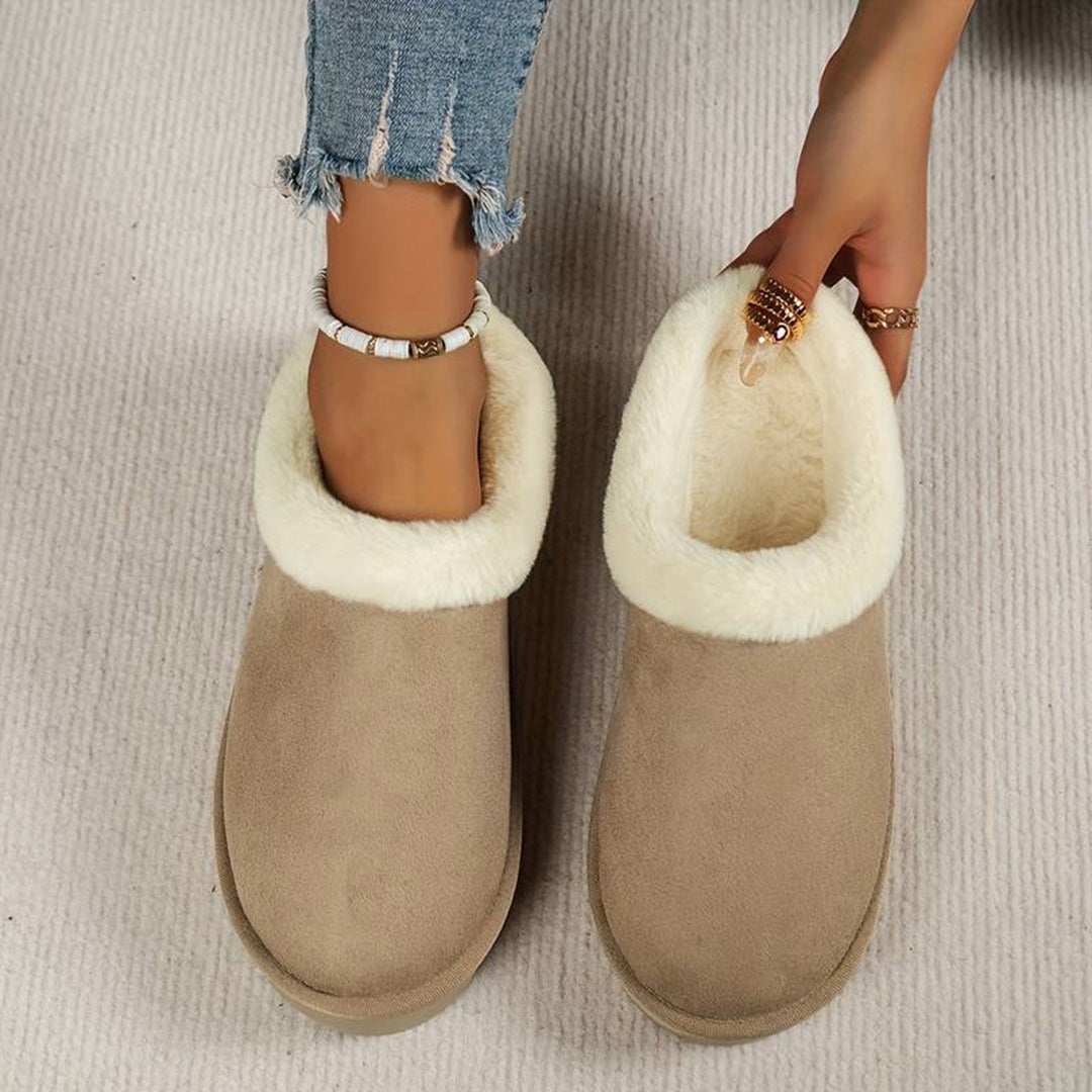 Women's slip-on winter boots with plush lining, low-profile silhouette, cozy cold-weather style