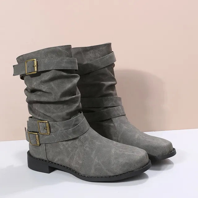 Women's brown slouch mid-calf boots with buckle strap detail and relaxed silhouette