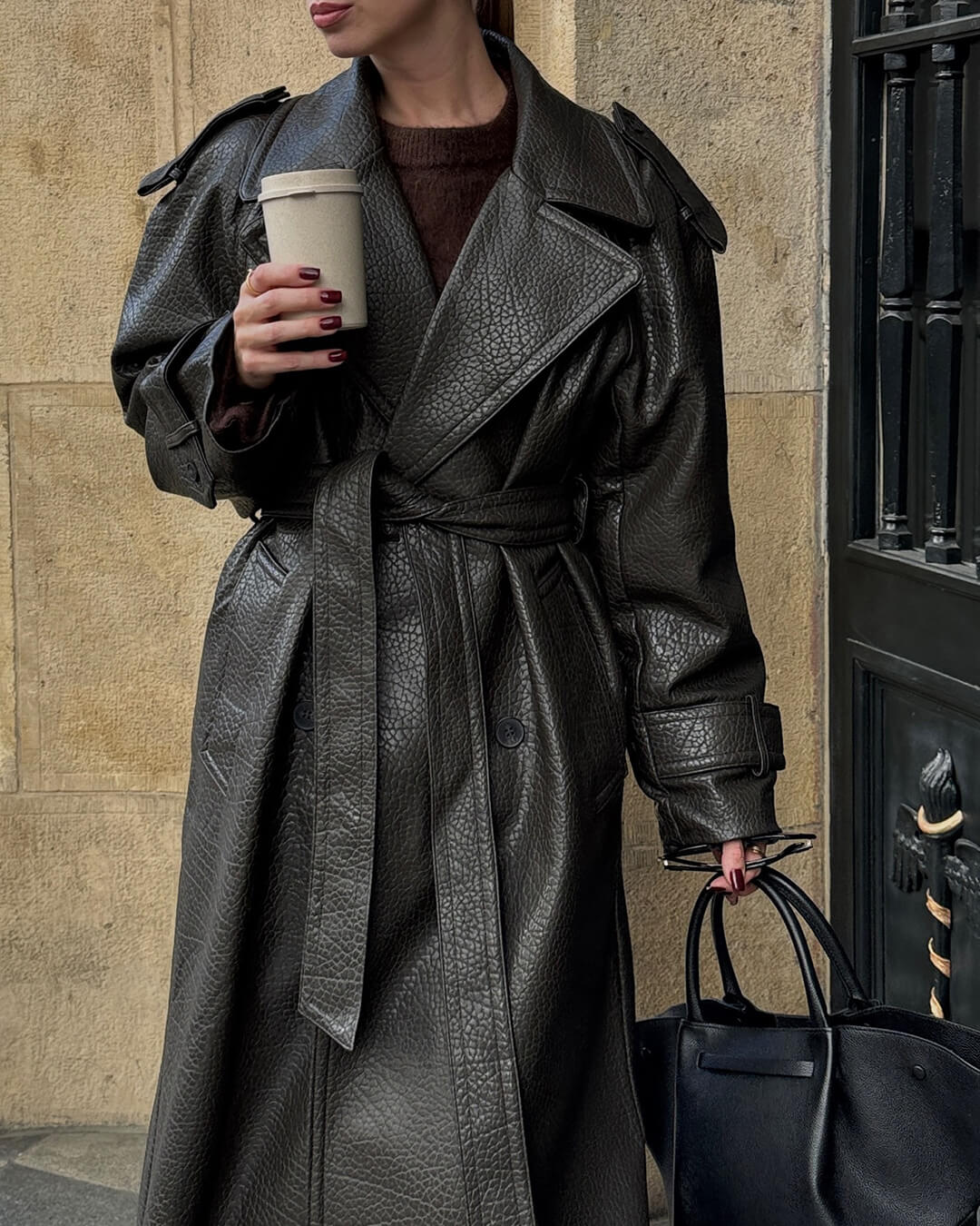Women's black long trench leather coat sleek silhouette extended coverage modern professional style