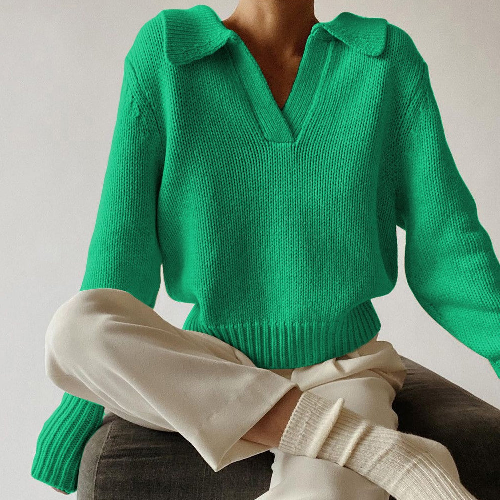 Women's loose fit knit sweater in neutral tones with bold lapel irregular design detail