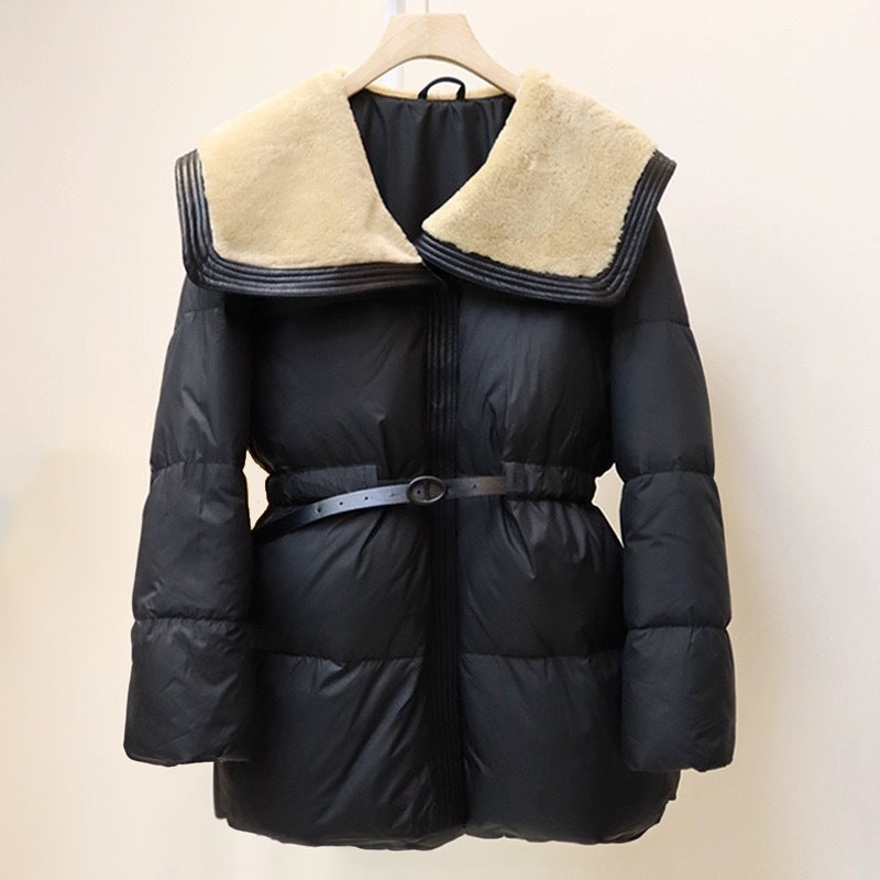 Women's black puffer down jacket with plush velvet collar and cinched waist belt for slim silhouette