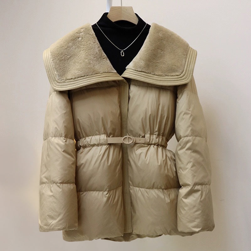 Women's black puffer down jacket with plush velvet collar and cinched waist belt for elegant silhouette