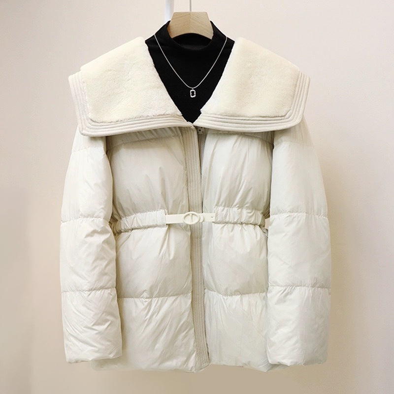 Women's black puffer down jacket with plush velvet collar and cinched waist belt for slim silhouette
