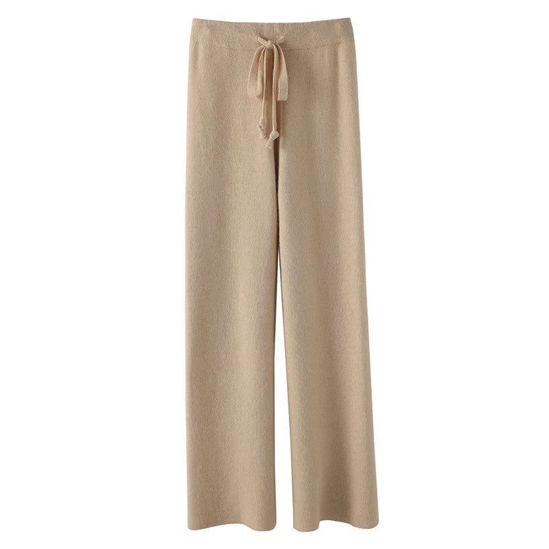 Women's beige knitted wide-leg pants with flowing silhouette, relaxed fit cozy autumn-winter essential