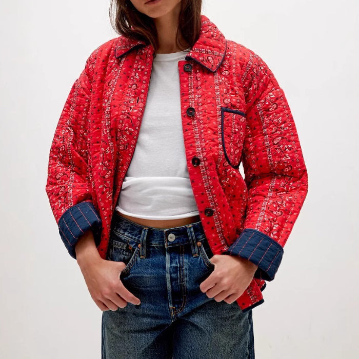 Women's relaxed-fit quilted jacket with vertical quilting, contrast trim, and subtle 3D texture