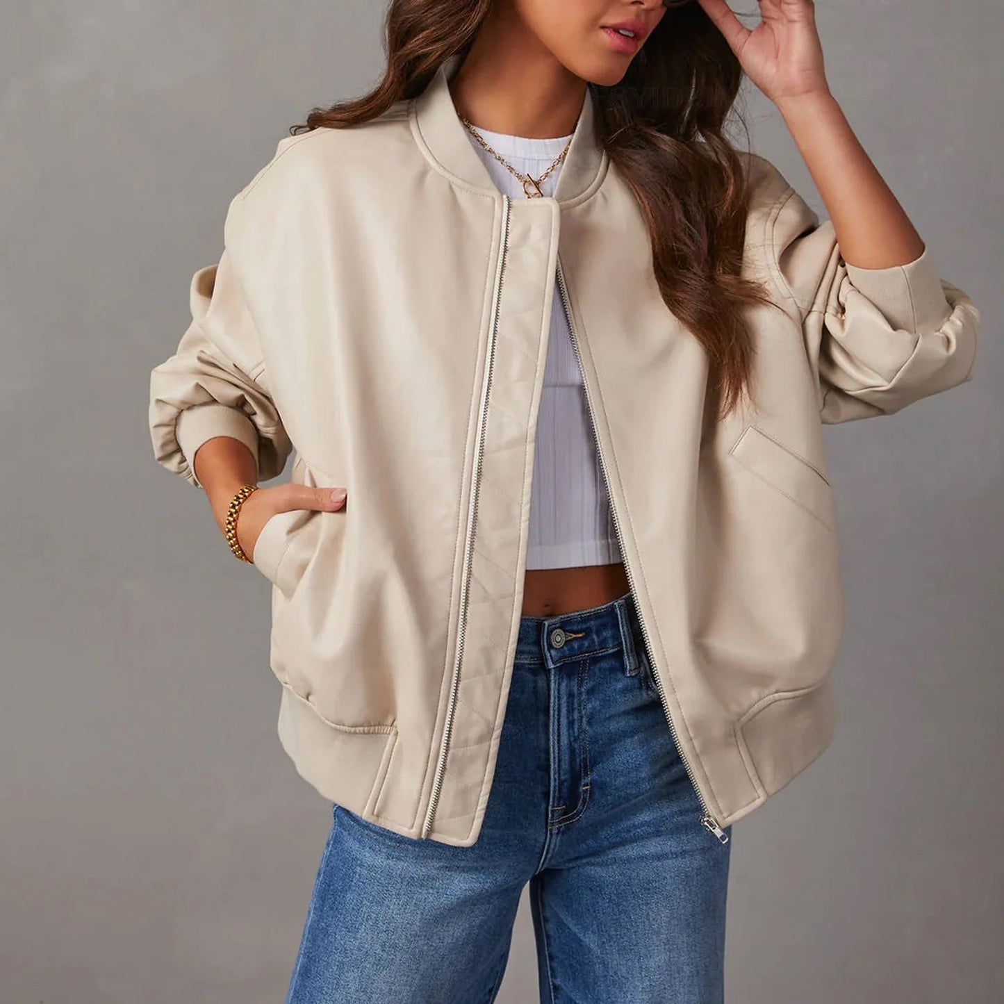 Women's black PU leather moto jacket with edgy zipper closure and sleek band collar