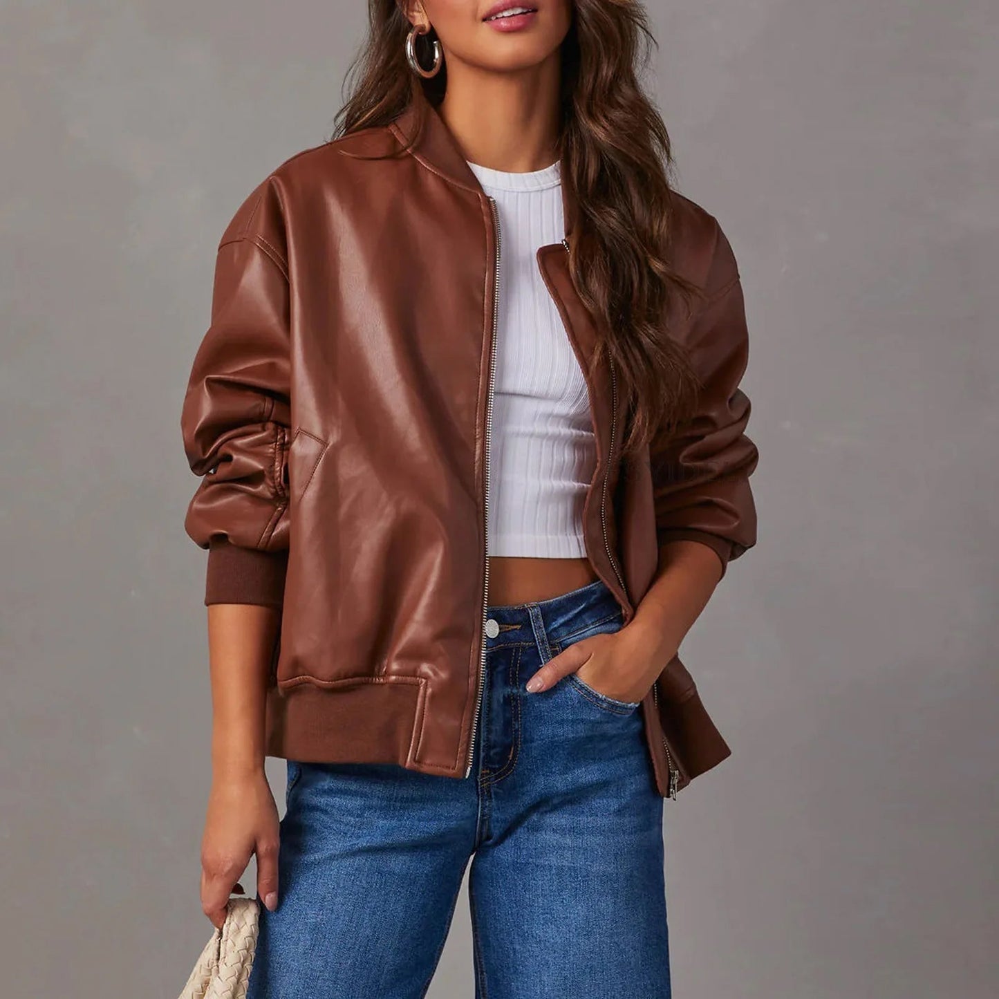 Women's black PU leather moto jacket with edgy zipper closure and sleek band collar