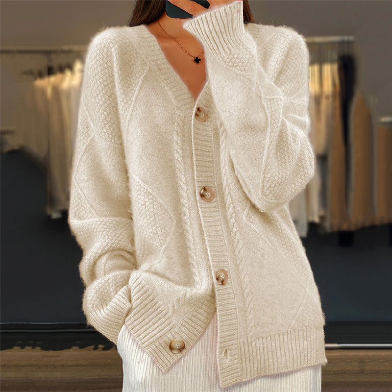 Soft pink women's cable knit cardigan with V-neck button closure and luxurious wool-blend fabric